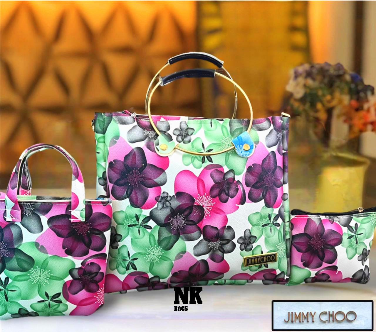 1030D. JIMMY CHOO purse, 3 pc combo, Round steel dual handle, flowery printed. Size